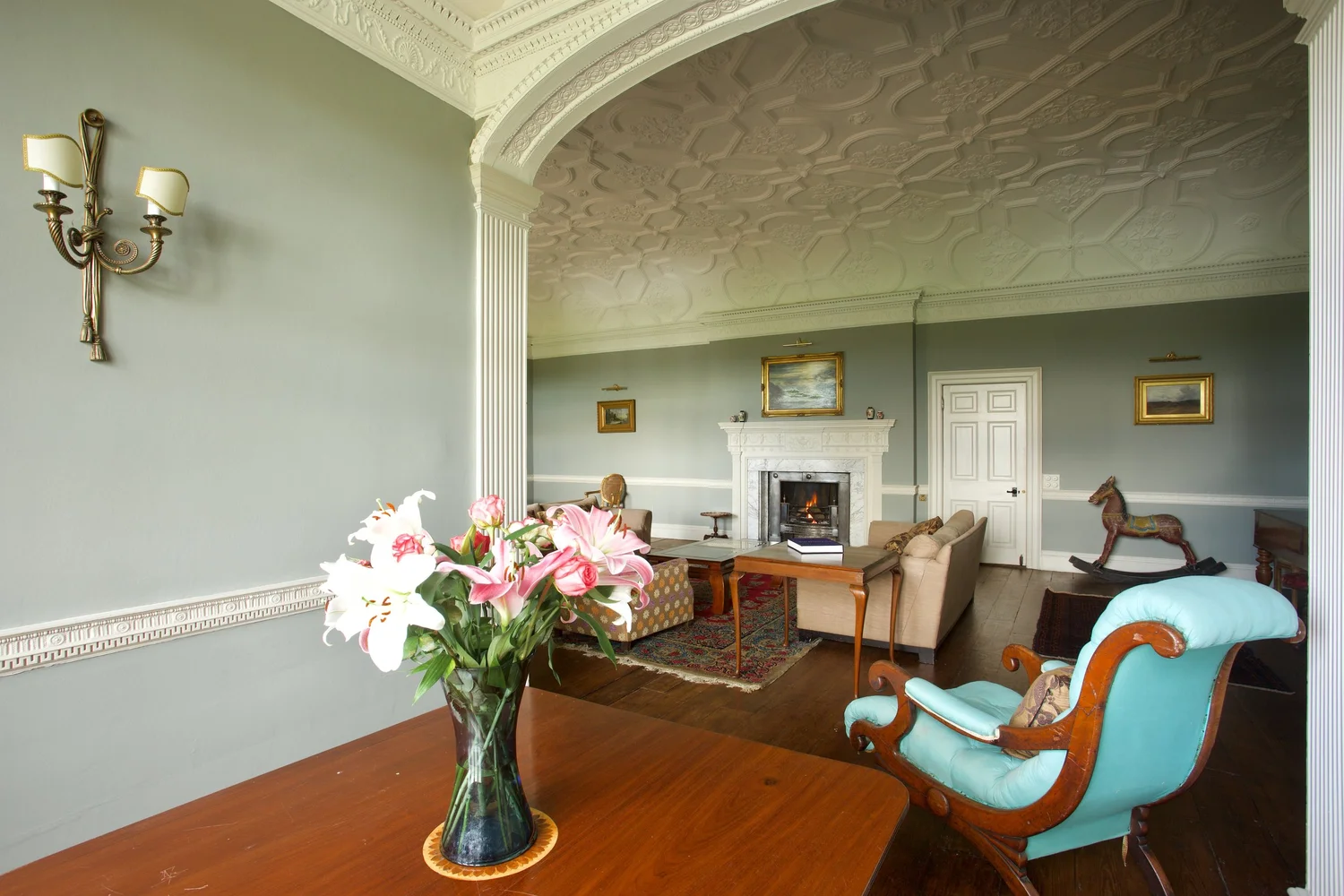 The great chamber, a grand panelled sitting room with tall windows