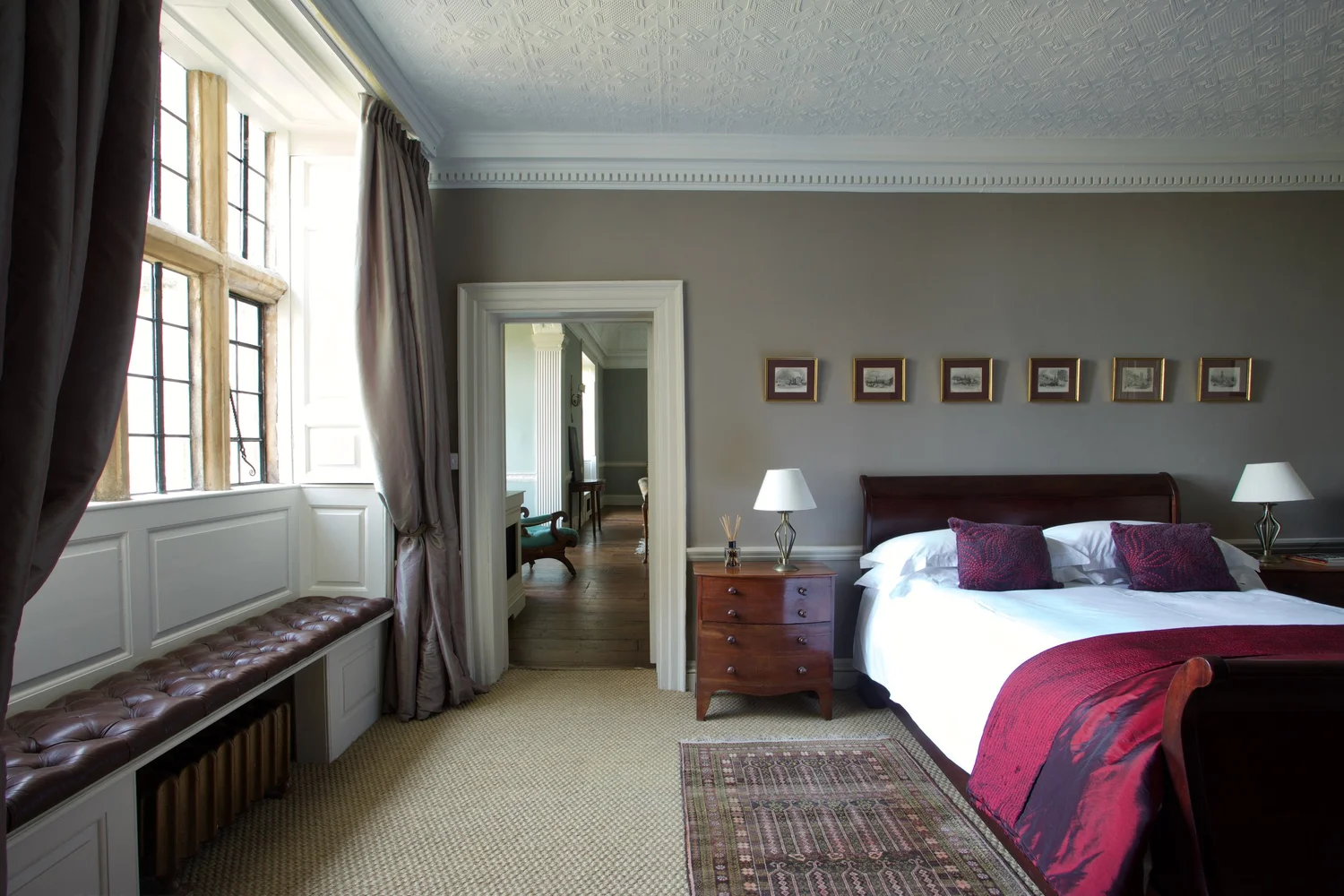 A characterful bedroom with a soft bed and antique furnishings