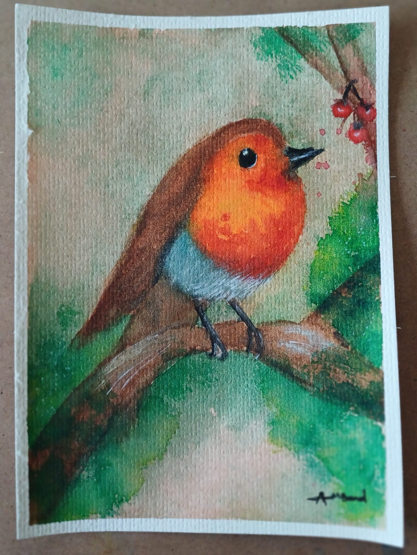 Watercolour robin on a branch beside red berries